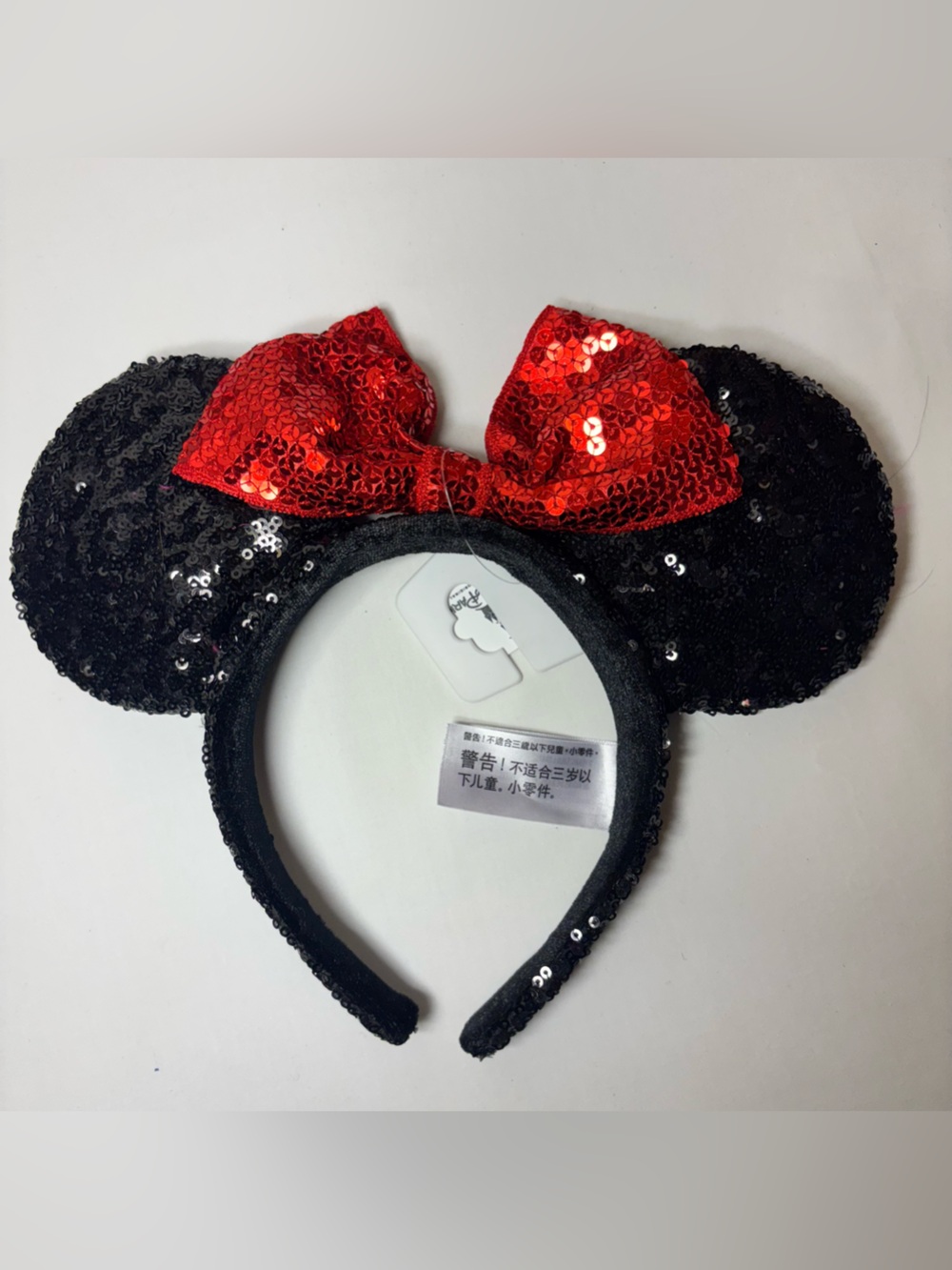 Official Disney Parks Sequin Minnie Mouse Ear Headband with Red Bow